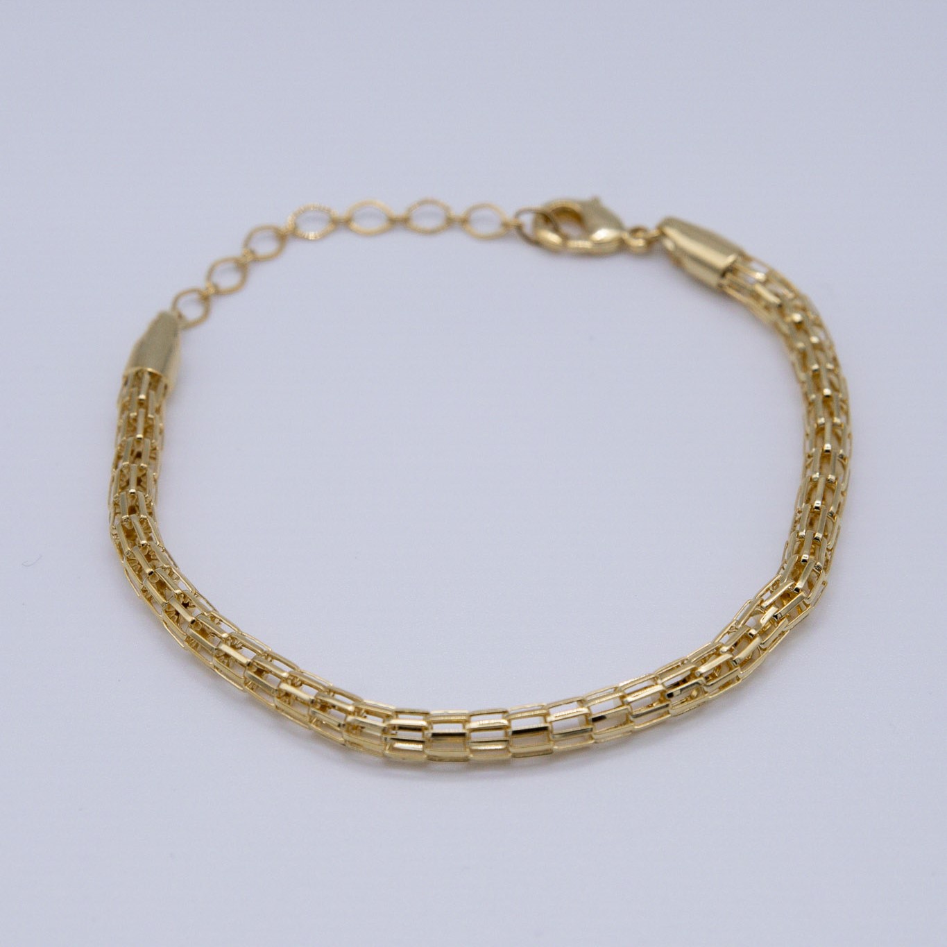 BRACCIALE CON PICCOLE CATENE INTRECIATE