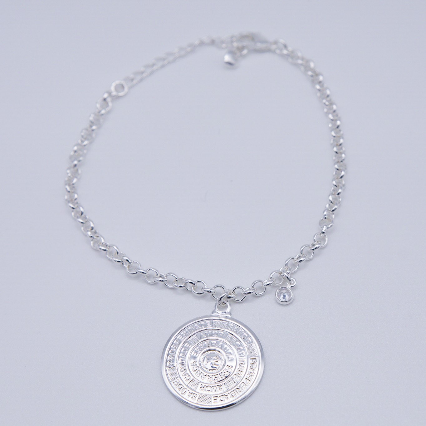 BRACCIALE CON MEDAGLIA E PUNTO LUCE PENDENTE