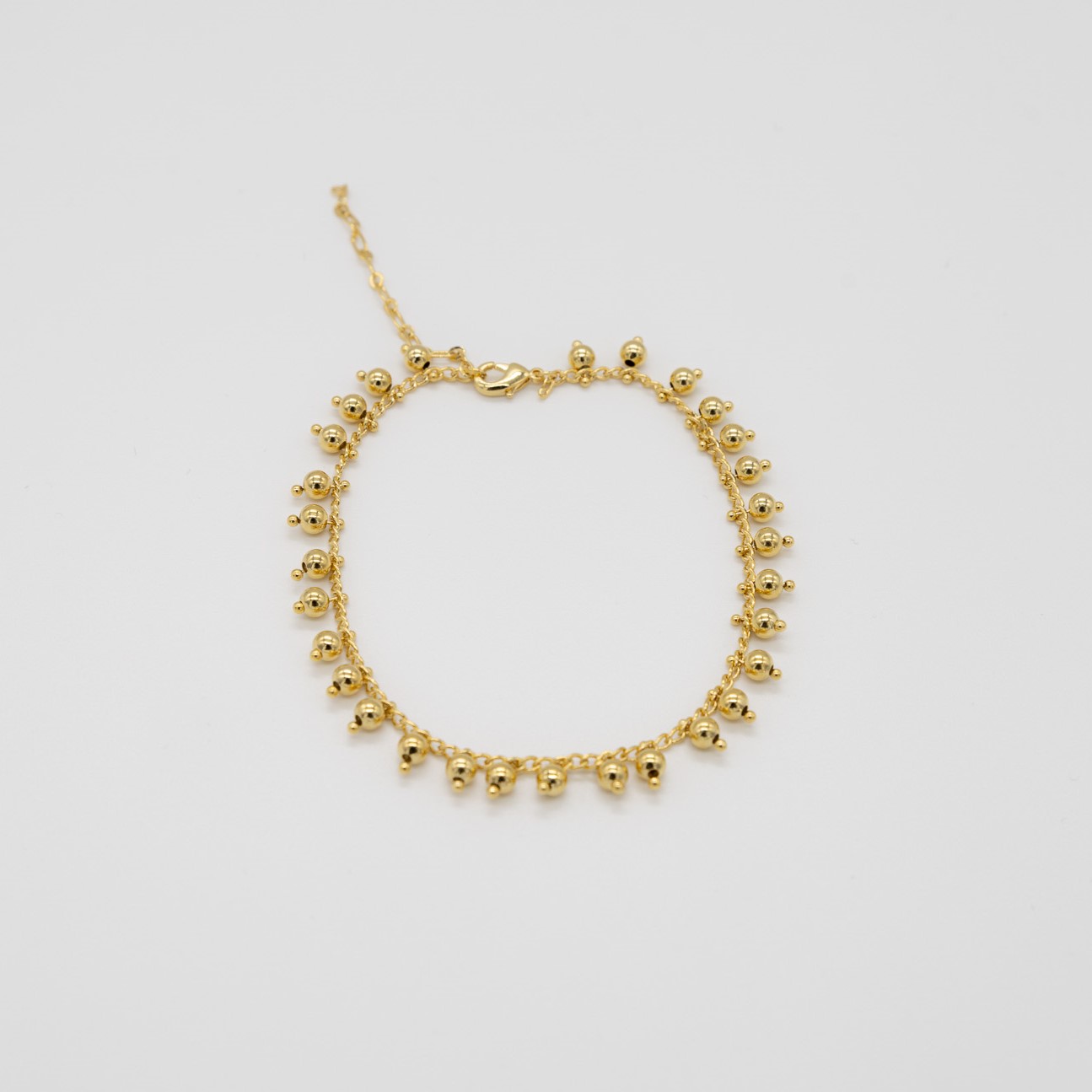 CAVIGLIERA CON SFERE PENDENTI