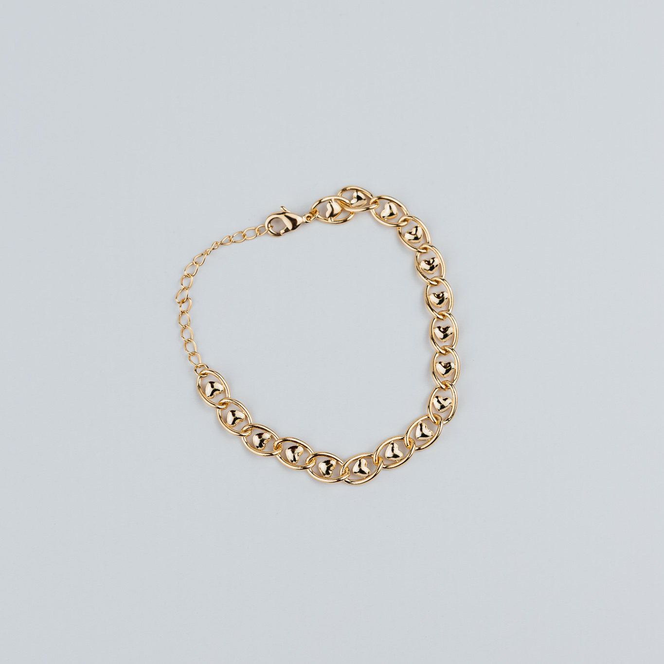 BRACCIALE A MAGLIE CON CUORE AL CENTRO