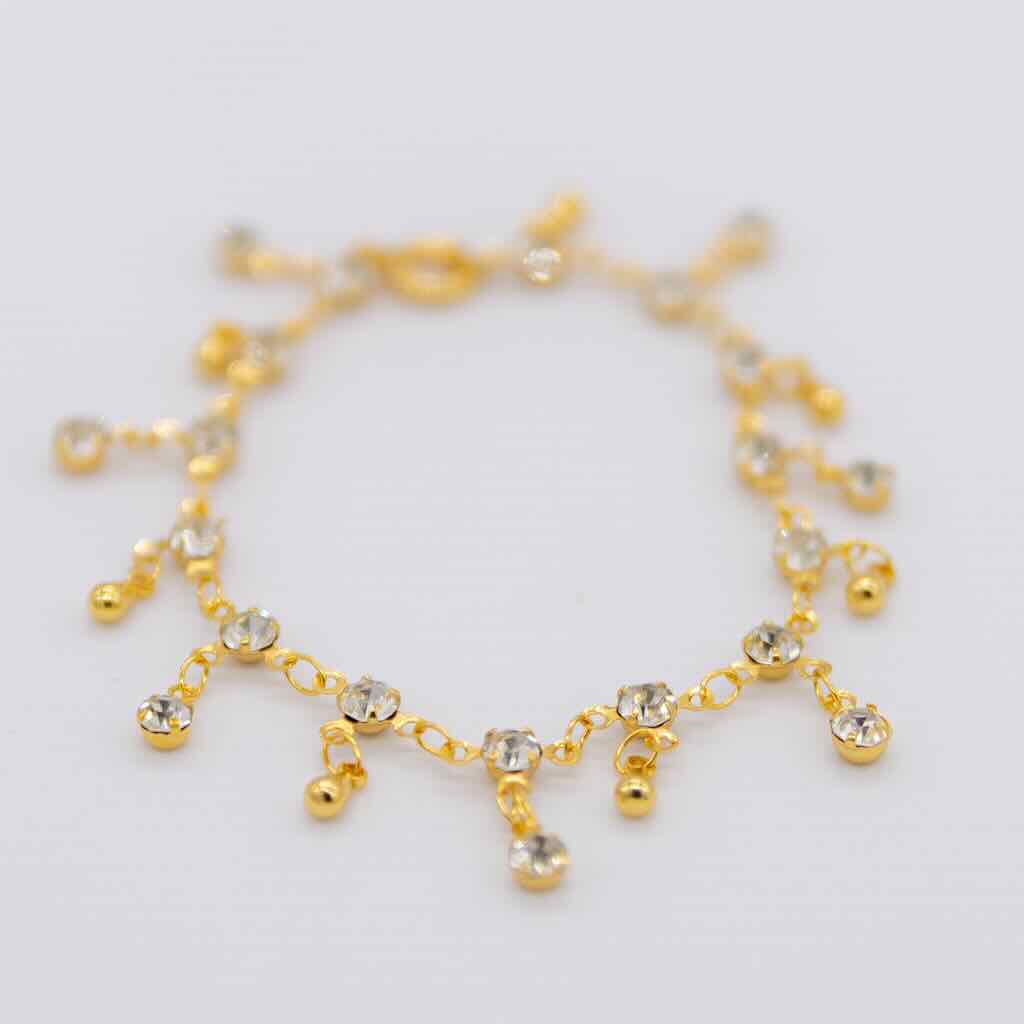 BRACCIALE CON PUNTI LUCE PENDENTI E GOCCE