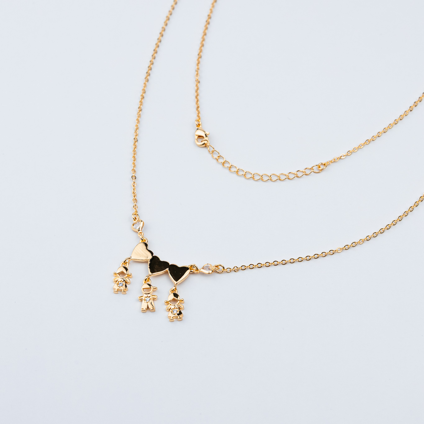 COLLANA DUE FIGLIE E UN FIGLIO CON TRE CUORI LISCI E UN PUNTO LUCE